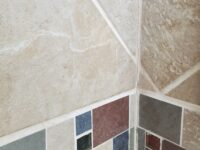 cracked grout in a shower corner