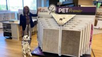 Mimi Mulugeta next to PetPremier display