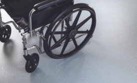 Wheelchair upon HMTX Teknoflor TPU Flooring
